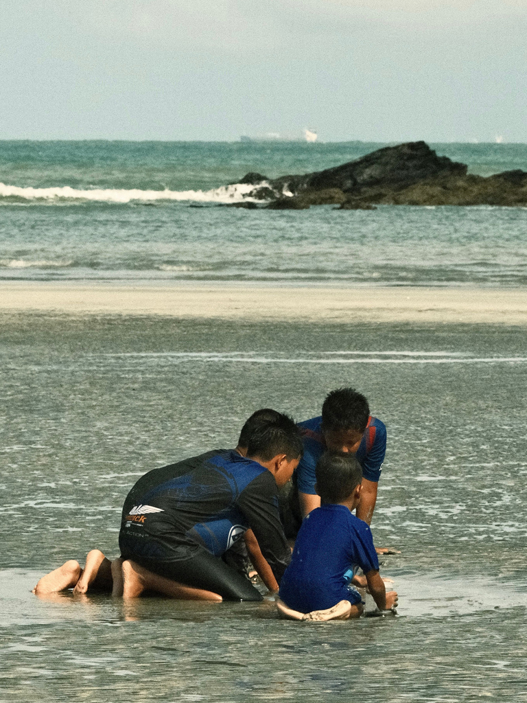 boys having fun at the beach
